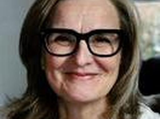 Ingrid Wolfe, a white woman with short brown hair and glasses.