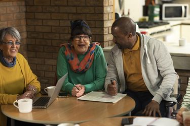 A group of older people having a conversation about mental health