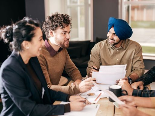 A group of diverse people talking in a meeting