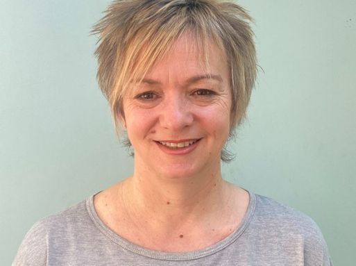 Andrea Wigfield, a white woman with cropped blonde hair