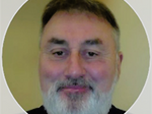 Michael Gormley, a whute man with dark hair and a grey beard.