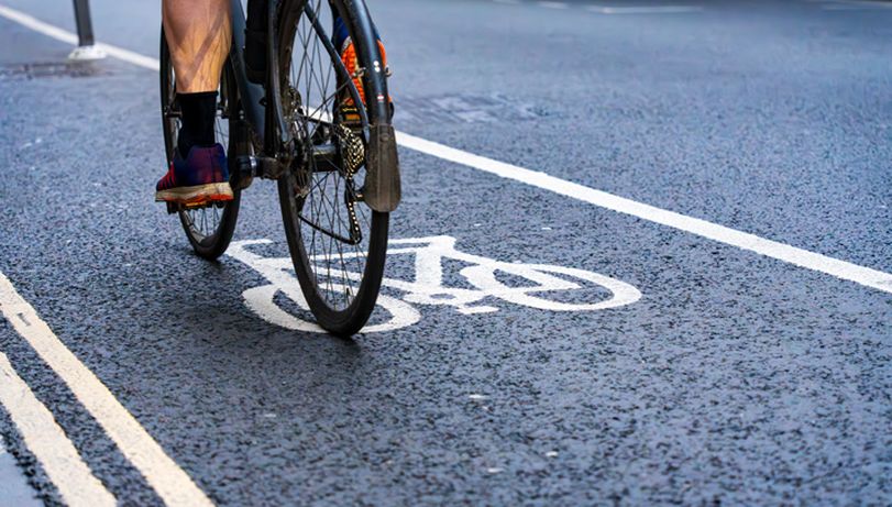 A close up of a bike cycling along a bike path