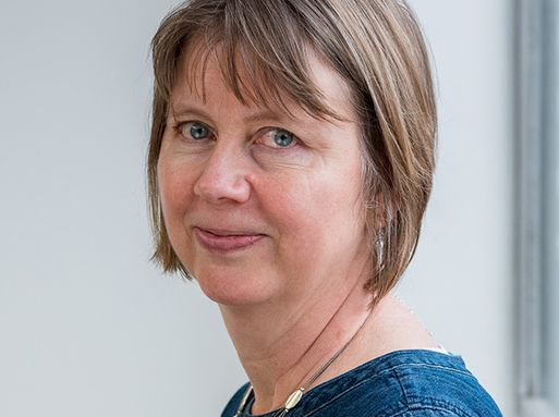 Helen MacIntyre, a white woman with short brown hair