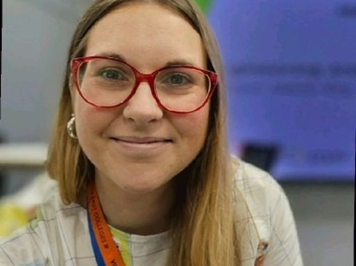 Helayna Jenkins, a white woman with long brown hair and glasses