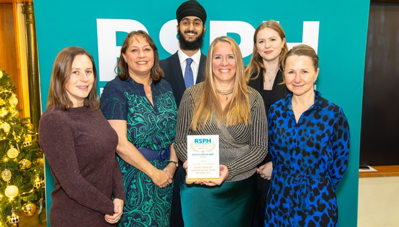 Six Awards winners stood in front of RSPH banner with Award