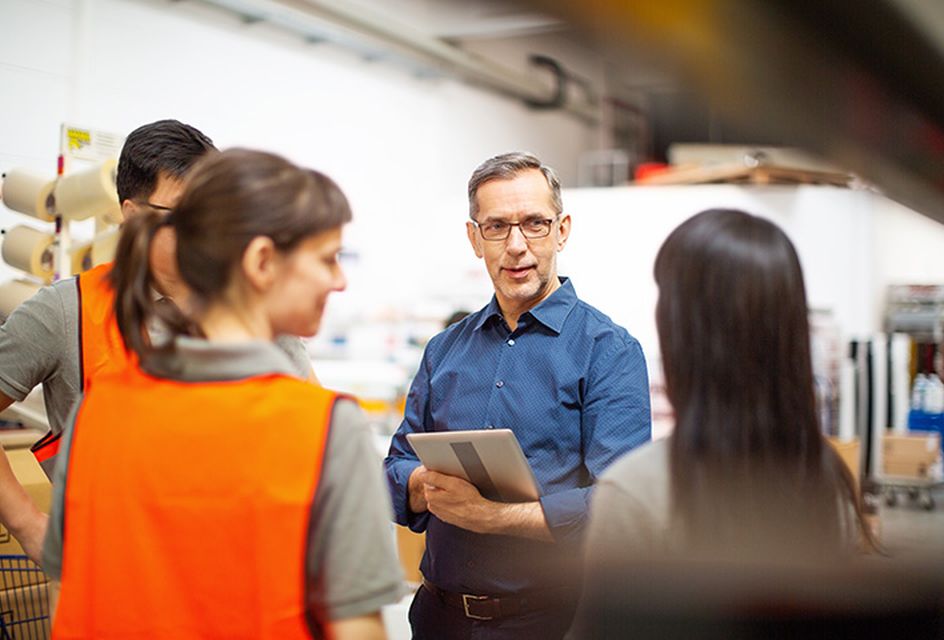 A manager instructing staff about health and safety